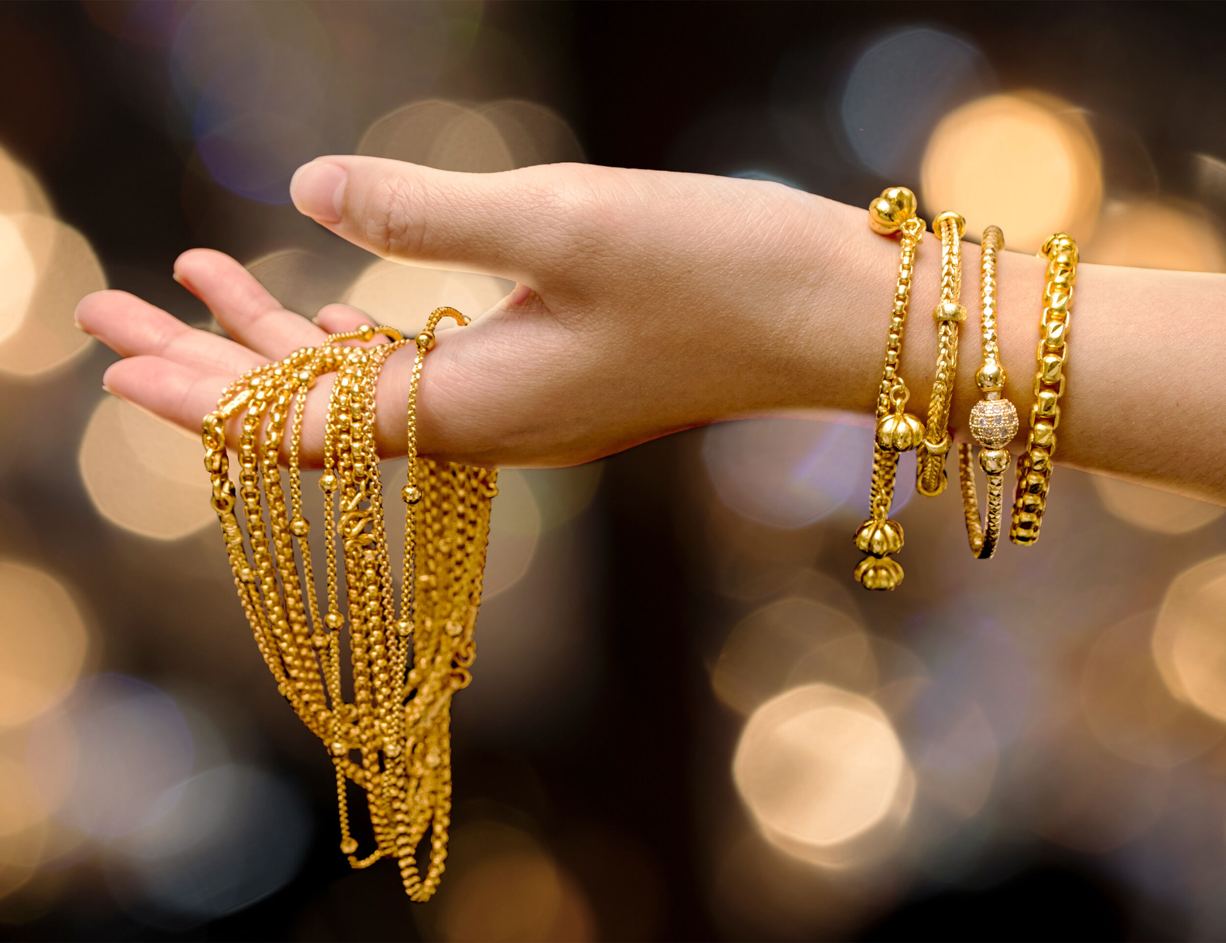 Gold jewelry held in hand during Akshaya Tritiya for auspicious purchases